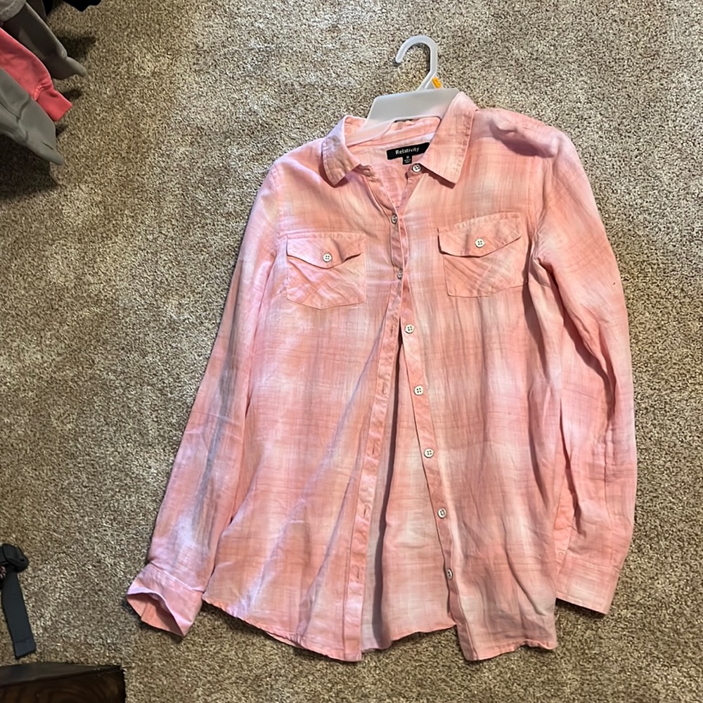 Pink and white button-down flannel shirt.